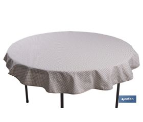 Mantel redondo antimanchas resinado con estampado de topos blancos | Materiales: 50% algodón y 50% poliéster | Diámetro: 1,40 m