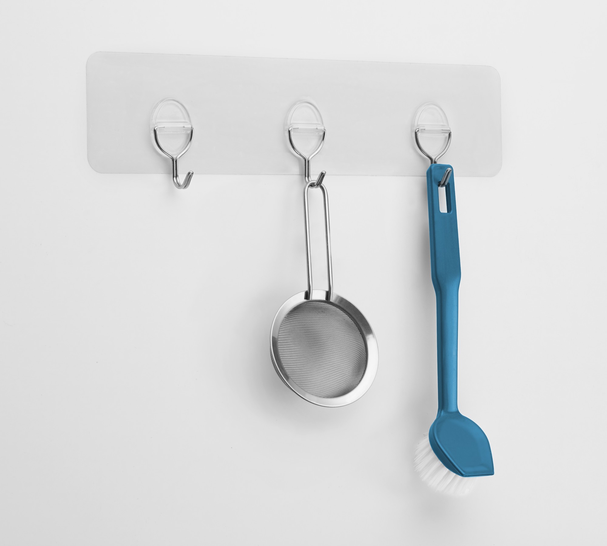 Colg. adherente reutilizable con tres ganchos móviles / transparente