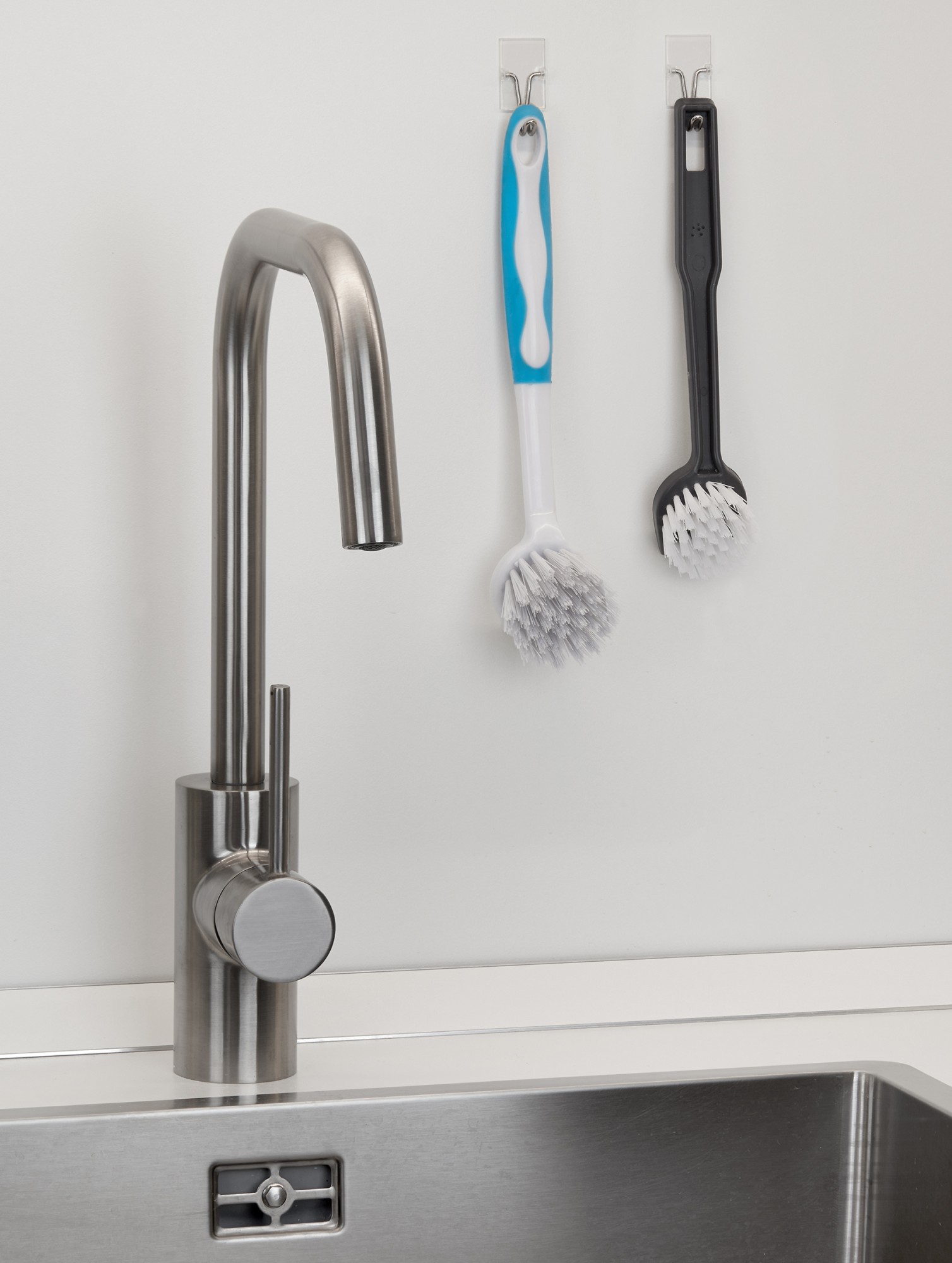 Colgador adhesivo con gancho móvil / transparente