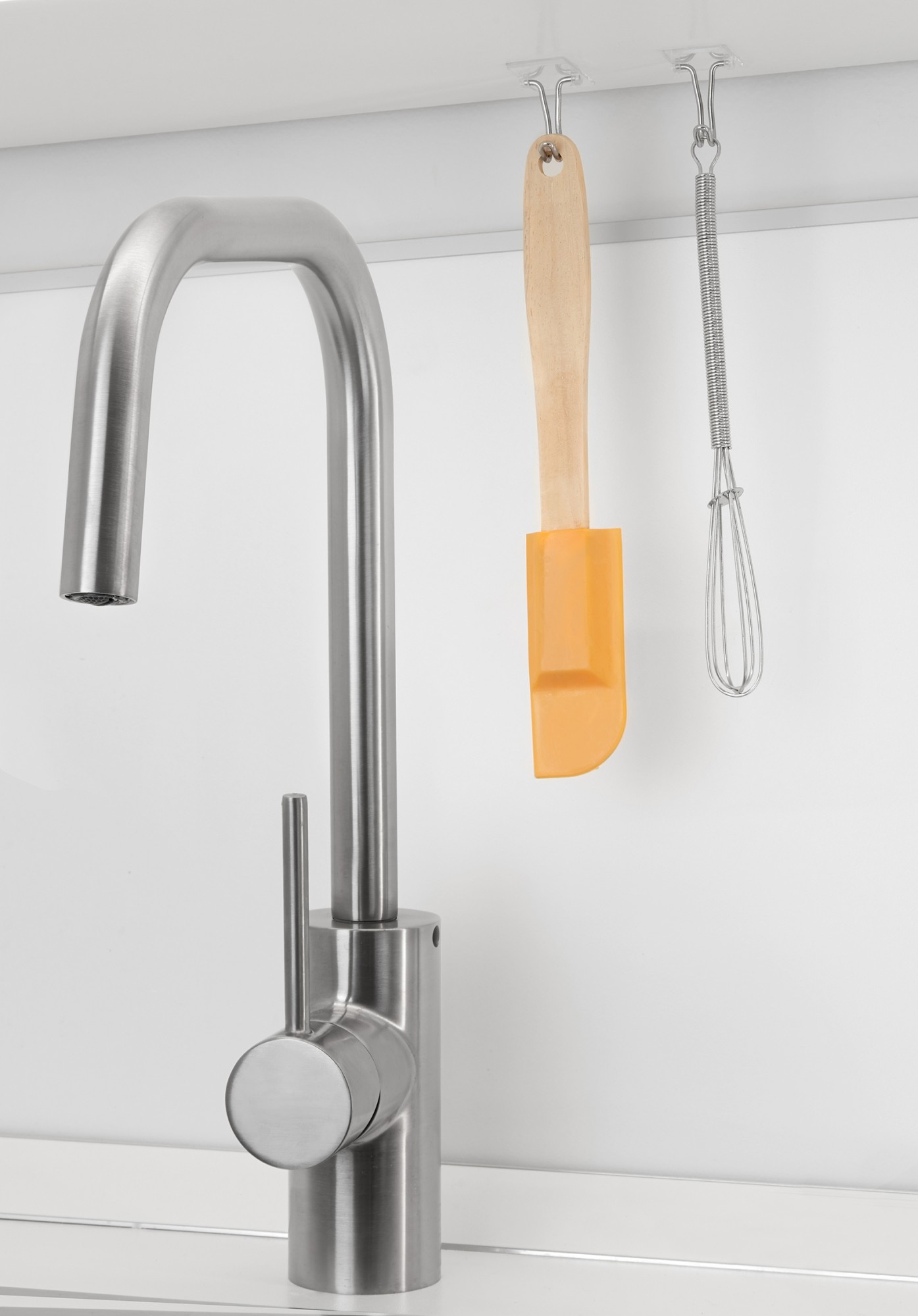 Colgador adhesivo con gancho móvil / transparente