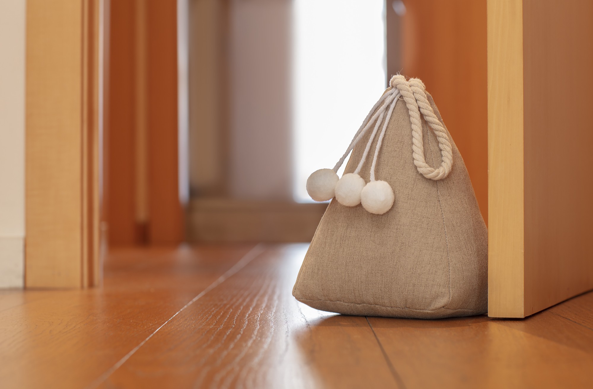 Tope de puerta textil 1 Kg. Saco / beige