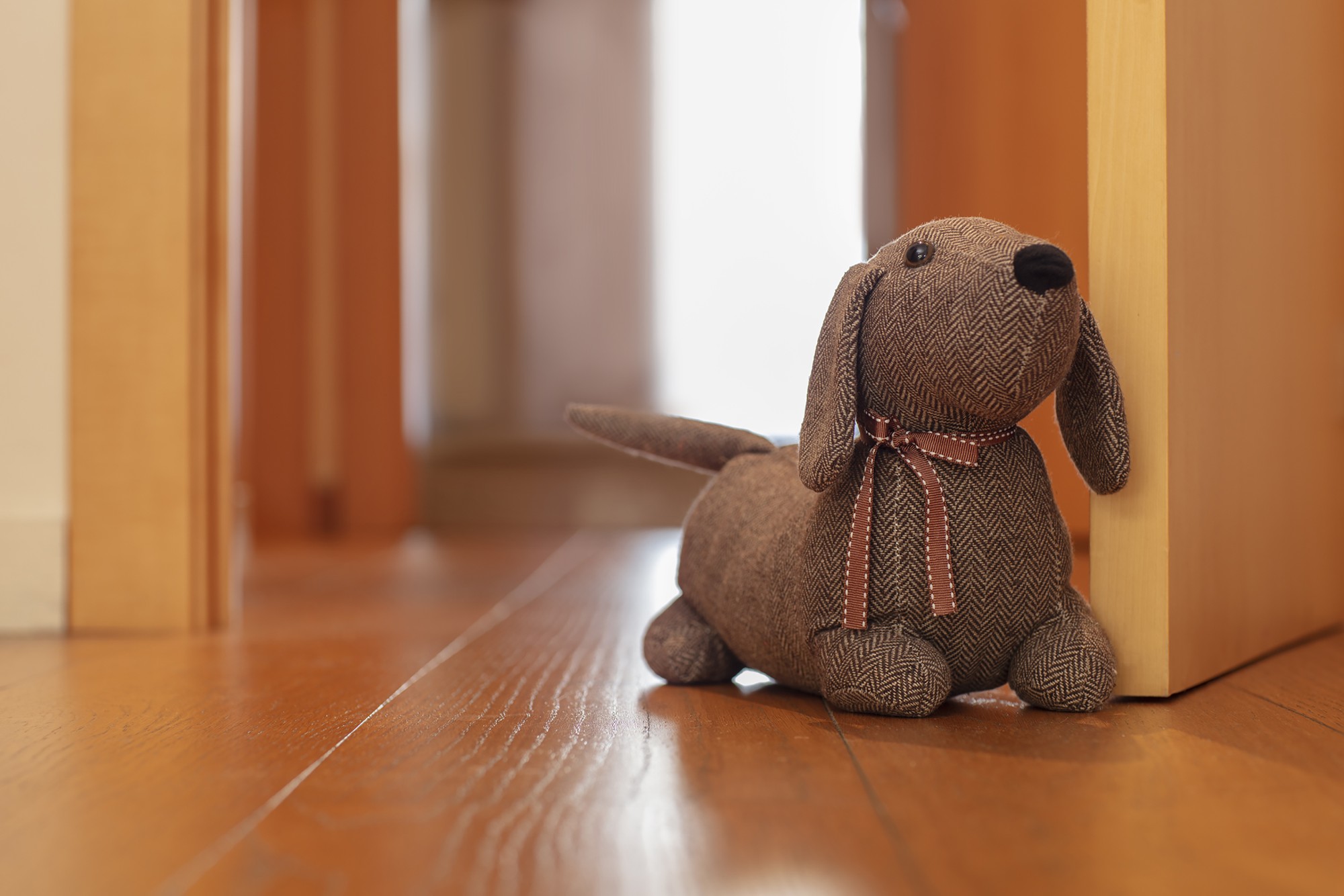 Tope de puerta textil 1 Kg. Perro / marrón